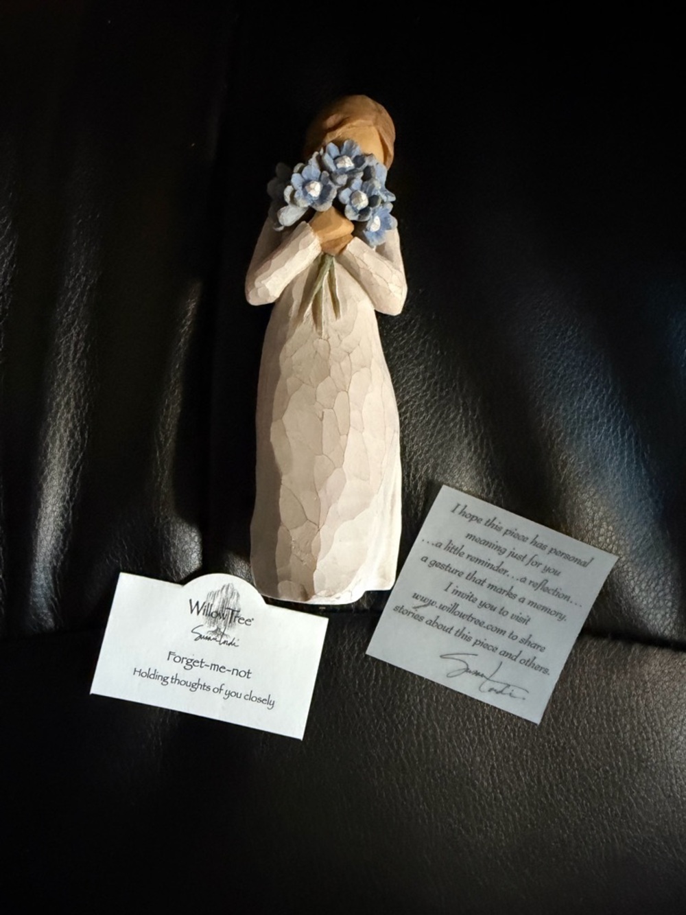 Willow Tree figurine with blue flowers and cream dress